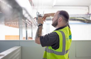 Electrician working in commercial office building