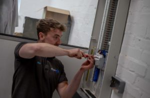 Electrician working in industrial building